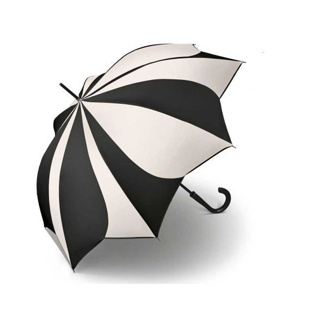 Open black-and-white striped umbrella resting on a light surface