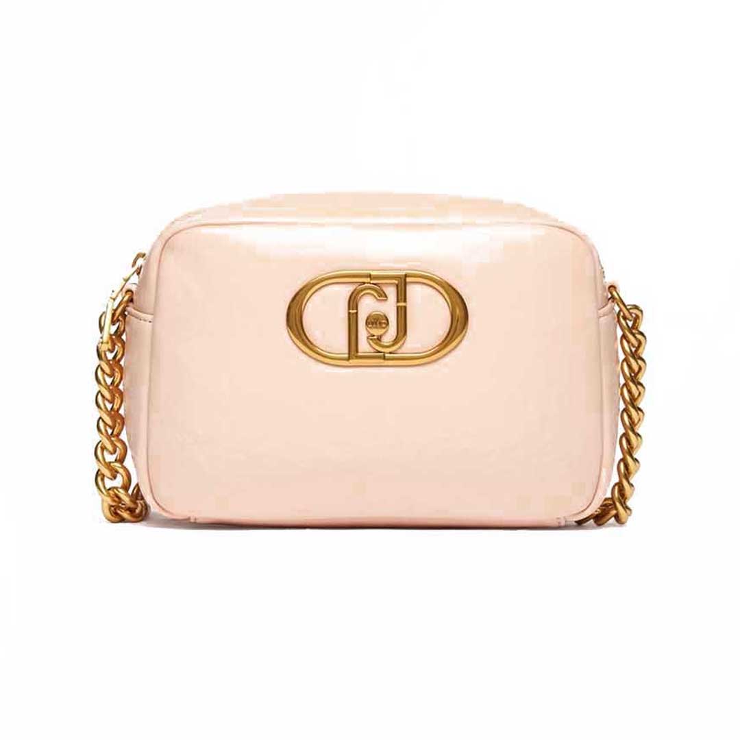 Soft pink small crossbody bag with a gold chain strap and a gold interlocking logo clasp on the front.