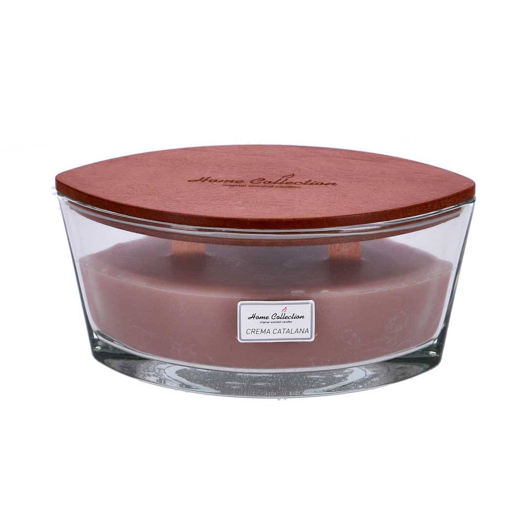 Glass jar candle with a round wooden lid labeled 'Home Collection' and a pink crema catalana wax inside.