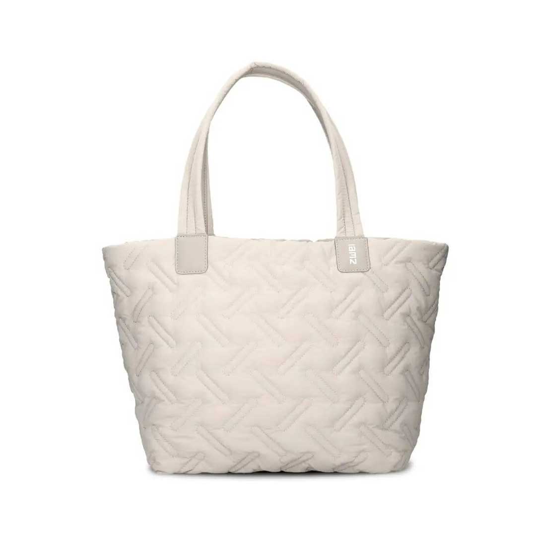 Beige quilted tote bag with two handles and subtle stitched pattern.