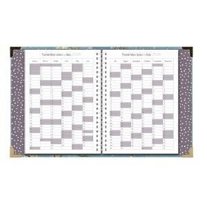 Open two-page spread of a monthly planner with blank calendar grids and dotted purple cover peeking at the edges.