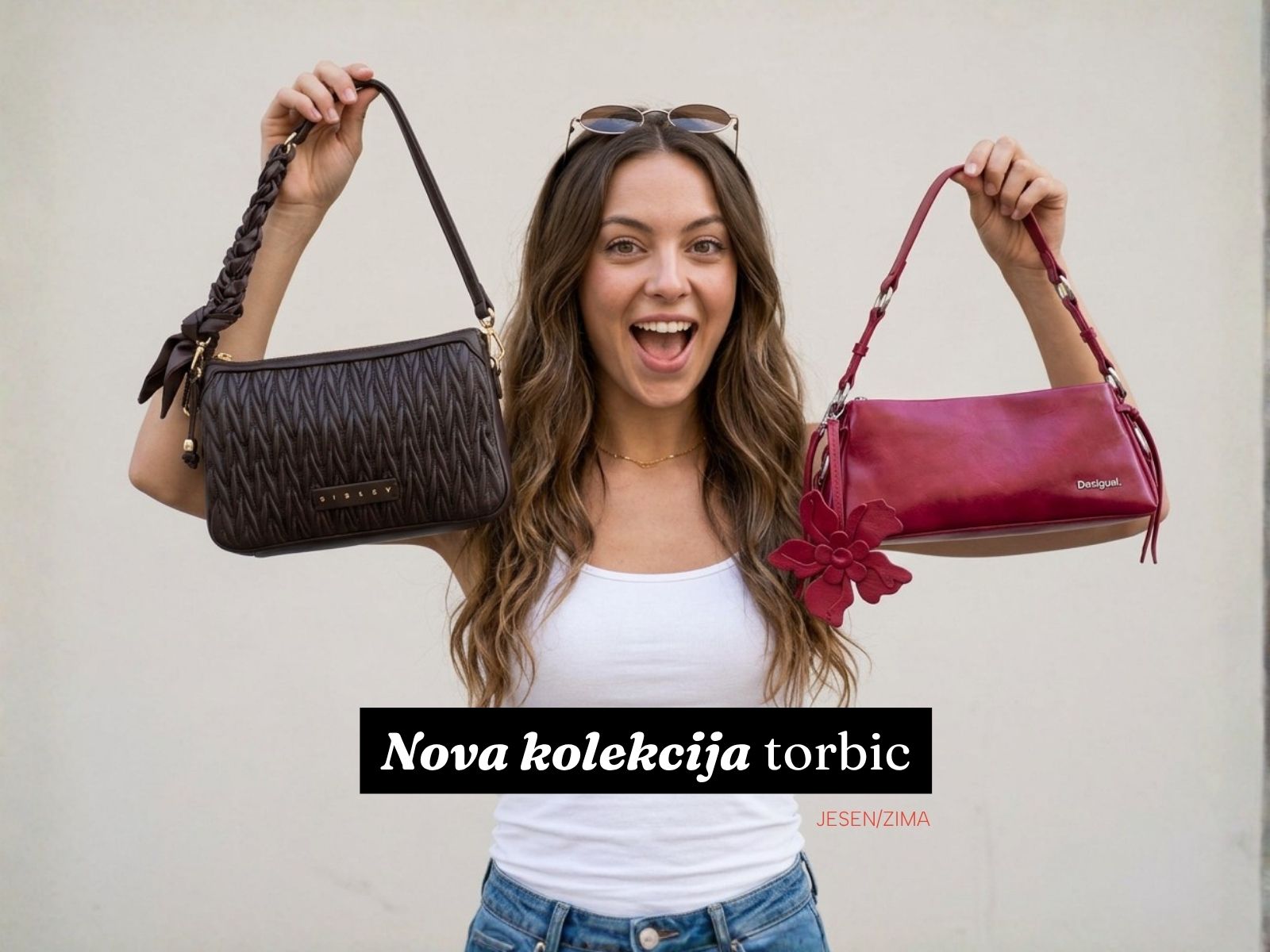 Model holding up two handbags: a black textured bag in her left hand and a pink bag with a flower charm in her right hand, advertising a new bag collection.